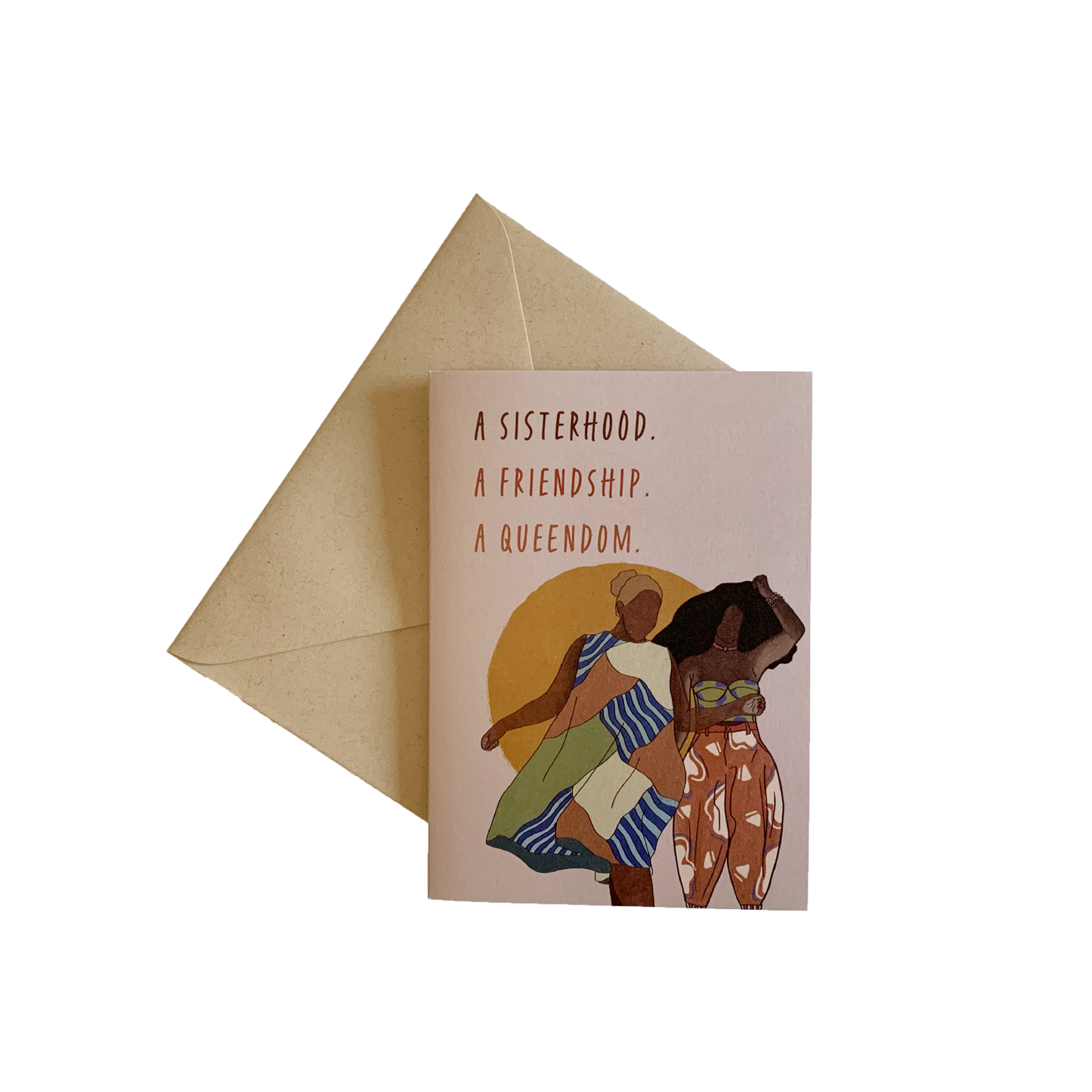 tan card against a kraft envelope on a transparent background that reads a sisterhood, a friendship, a queendom with an illustration of two black women standing next to each other