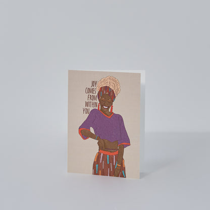 Joy Comes from Within greeting card with illustration of Black woman with blonde hair in head wrap purple shirt and funky colored pants