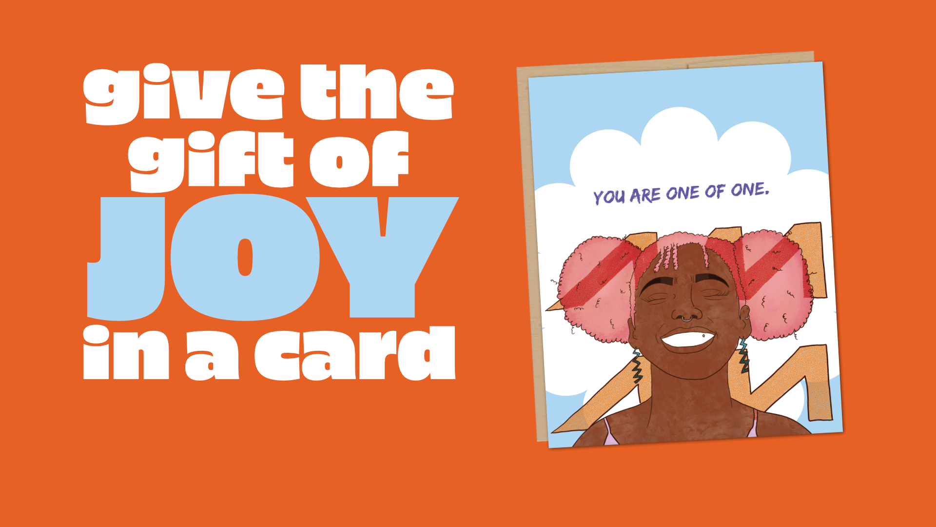 An orange promotional graphic with the text 'give the gift of JOY in a card' next to a sample greeting card illustration showing a smiling person with pink hair and the words 'YOU ARE ONE OF ONE.'.